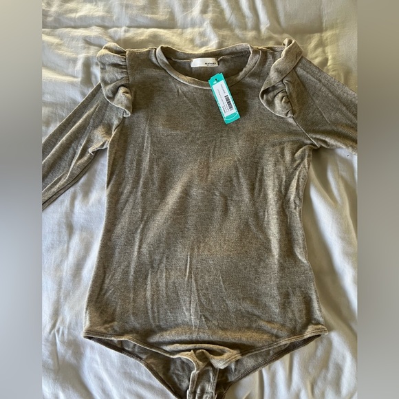 Heathery Ursa Ruffle Shoulder
Knit Bodysuit - Picture 5 of 8